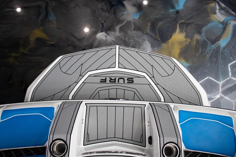 Slide: The Image of 2018 Nautique Super Air Nautique GS22 boat deck with sleek design and vibrant colors. - 10