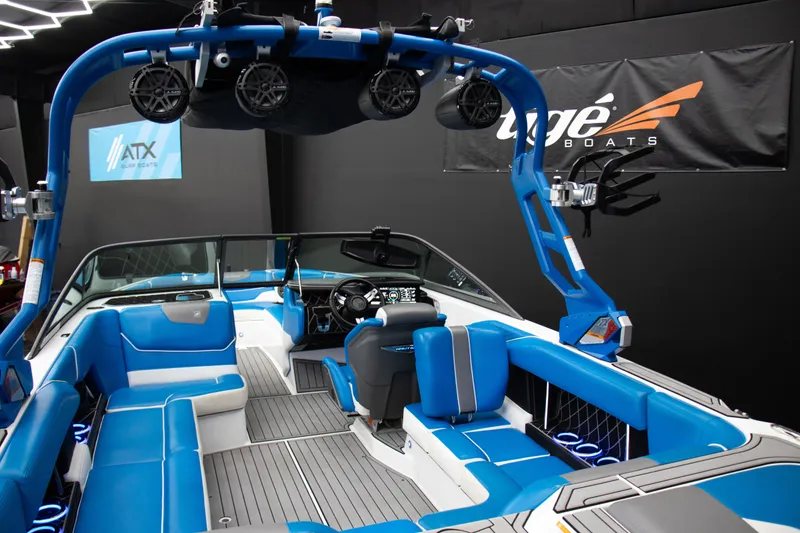 Slide: The Image of 2018 Nautique Super Air Nautique GS22 interior with blue seating and advanced audio system. - 11