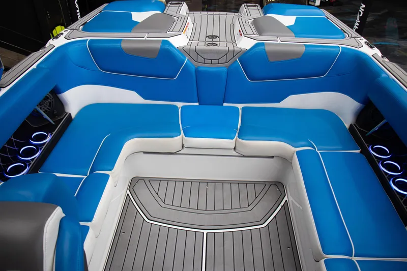 Slide: The Image of Luxurious blue seating in 2018 Nautique Super Air Nautique GS22 boat interior. - 8