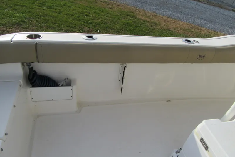 Slide: The Image of 2019 Key West 239 FS boat interior with rod holders and storage compartment. - 12