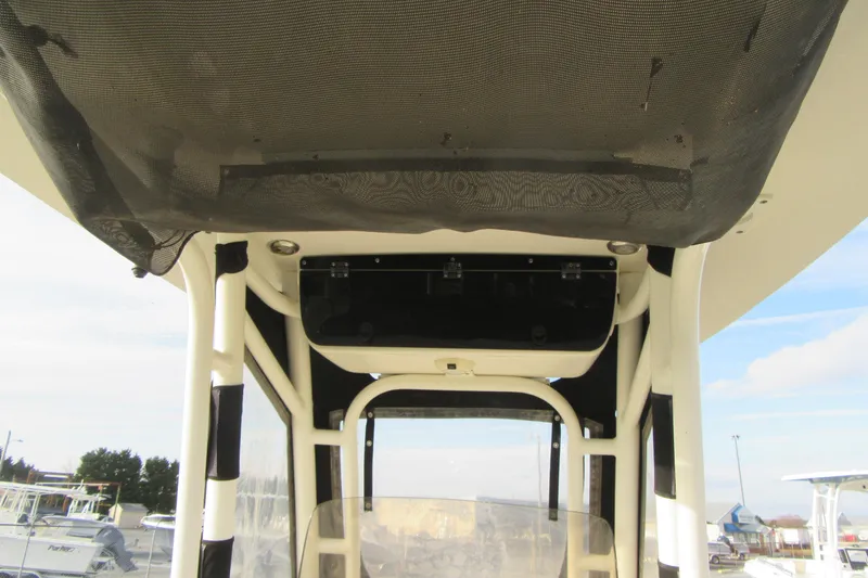 Slide: The Image of 2019 Key West 239 FS boat interior with overhead storage and netting. - 17