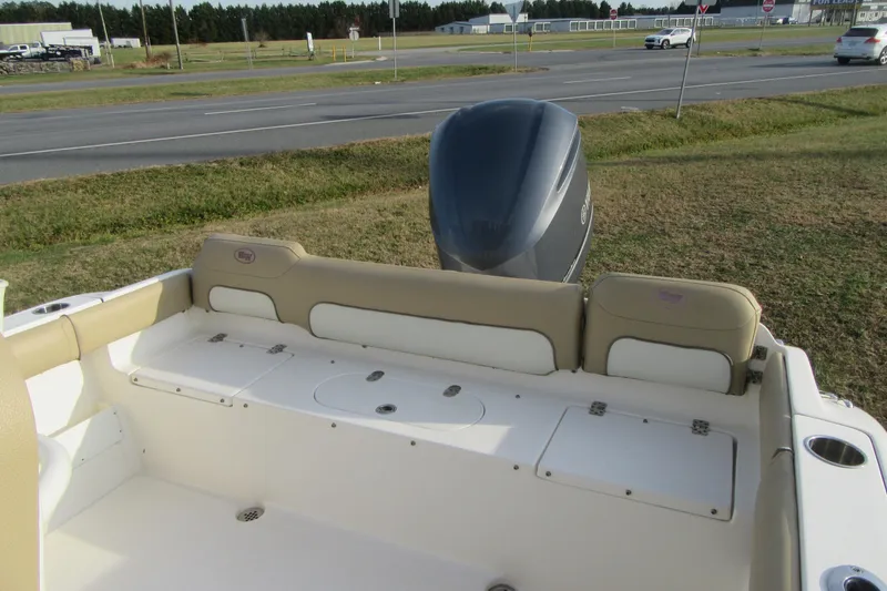 Slide: The Image of 2019 Key West 239 FS boat interior with seating and outboard motor. - 7