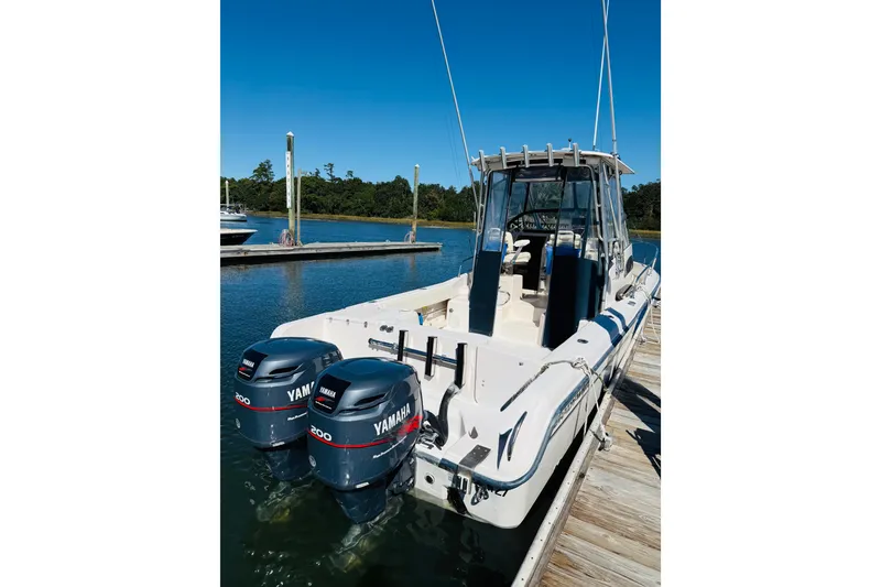Slide: The Image of 2001 Grady-White Sailfish 282 boat docked with twin Yamaha engines. - 2