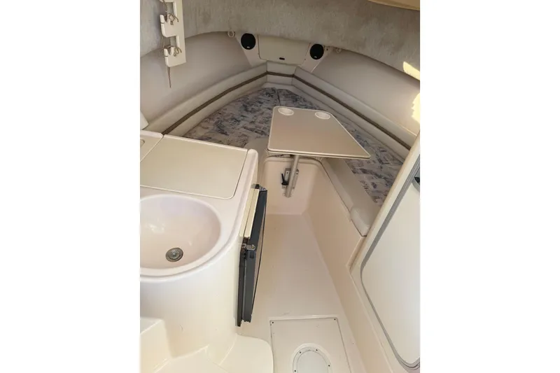 Slide: The Image of 2001 Grady-White Sailfish 282 cabin interior with sink and table. - 7