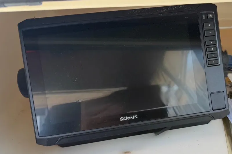 Slide: The Image of Garmin marine GPS device on 2001 Grady-White Sailfish 282 boat dashboard. - 8