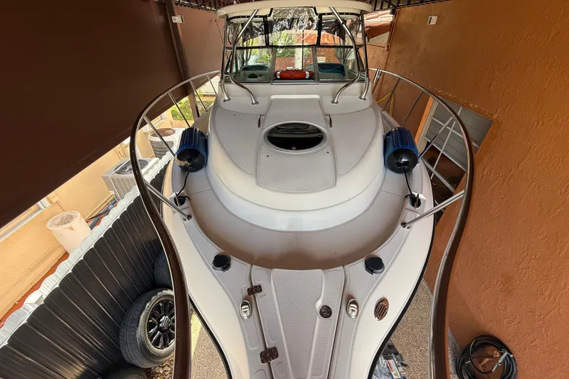 Slide: The Image of 2005 Seaswirl Striper 290 boat docked in a covered area, top view. - 13