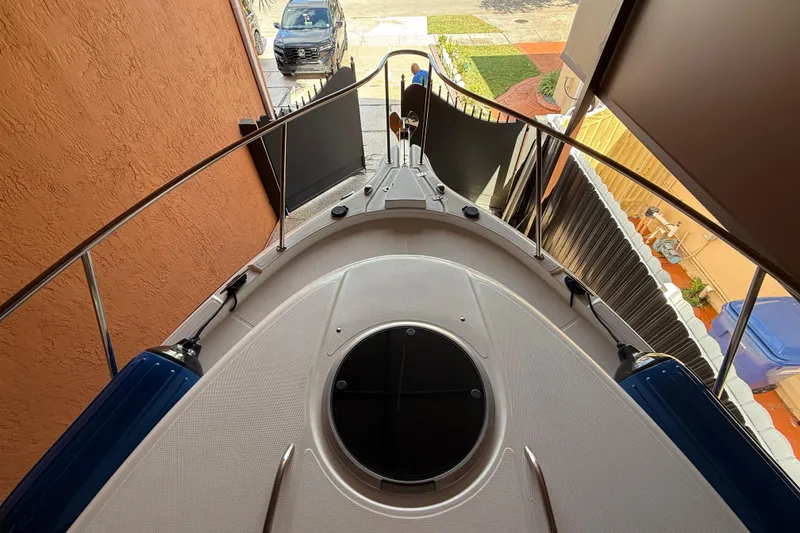 Slide: The Image of 2005 Seaswirl Striper 290 boat docked in a narrow space, viewed from above. - 14