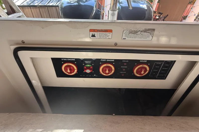 Slide: The Image of Control panel of a 2005 Seaswirl Striper 290 boat with engine switches. - 35