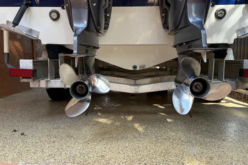 Slide: The Image of 2005 Seaswirl Striper 290 boat with dual propellers on a trailer. - 8