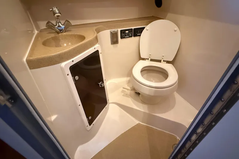 Slide: The Image of 2005 Seaswirl Striper 290 boat bathroom with sink and toilet. - 28