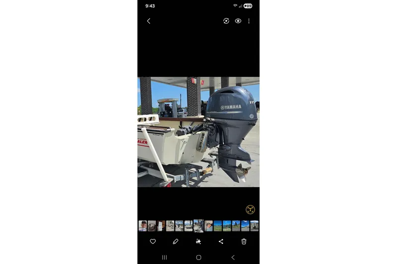 Slide: The Image of 1980 Boston Whaler Outrage 20 with Yamaha outboard motor at a gas station. - 4