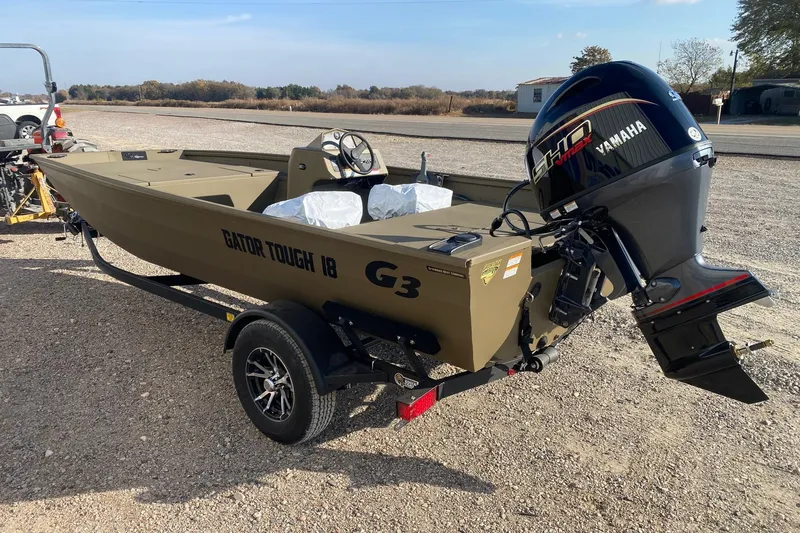 Slide: The Image of 2026 G3 Gator Tough 18 CC boat with Yamaha outboard motor on trailer. - 3