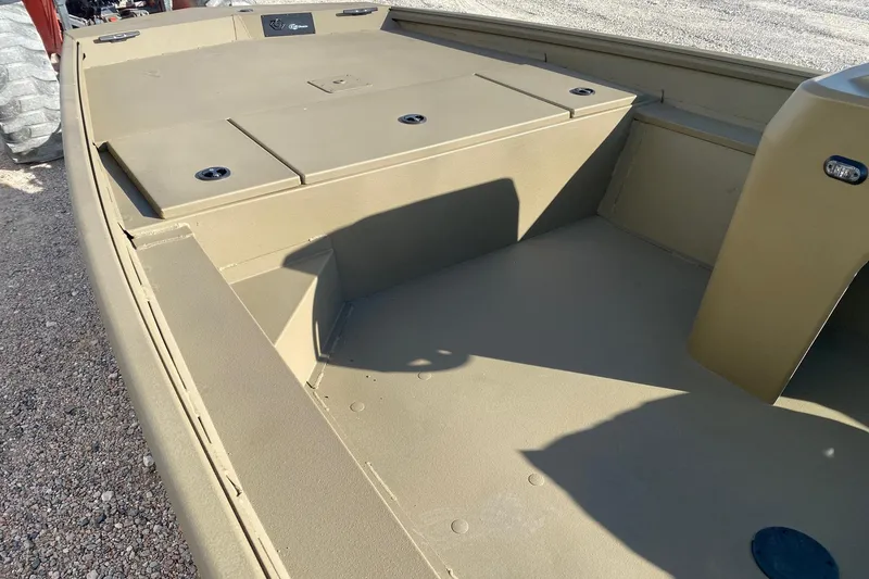 Slide: The Image of 2026 G3 Gator Tough 18 CC boat interior with storage compartments and console. - 8