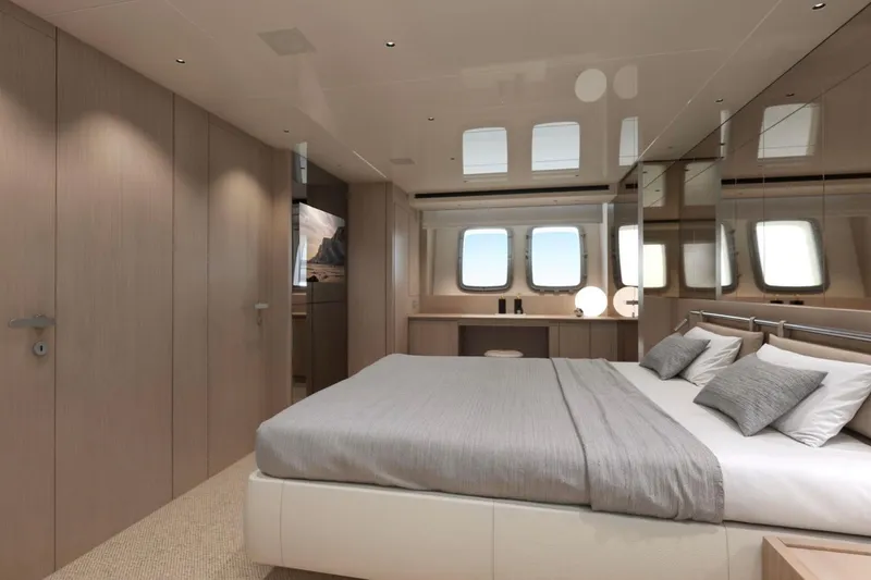 Slide: The Image of Luxurious bedroom interior of 2026 Sanlorenzo SX76 yacht with modern design and large windows. - 16