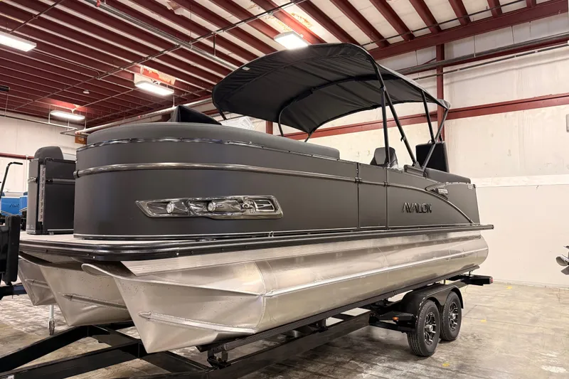 Slide: The Image of 2026 Avalon Catalina Platinum Quad Lounger pontoon boat in indoor showroom. - 6