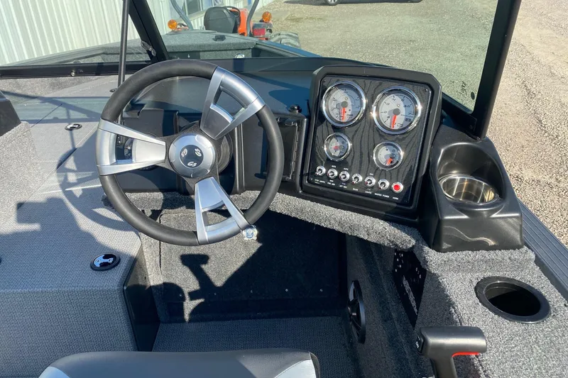 Slide: The Image of 2026 G3 Angler V18 FS boat dashboard with steering wheel and instrument panel. - 8