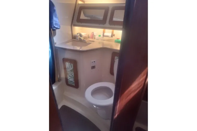 Slide: The Image of Bathroom interior of 1997 Hunter Passage 42 yacht, featuring sink and toilet. - 17