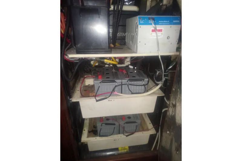 Slide: The Image of Electrical system of a 1997 Hunter Passage 42 sailboat, featuring batteries and wiring. - 23