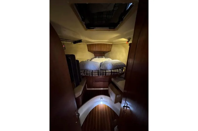 Slide: The Image of Cozy cabin interior of 1997 Hunter Passage 42 sailboat with bed and wooden accents. - 6