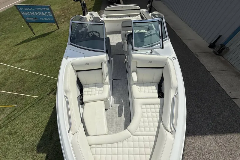 Slide: The Image of 2020 Cobalt R5 Surf boat with luxurious white seating and open cockpit design. - 12
