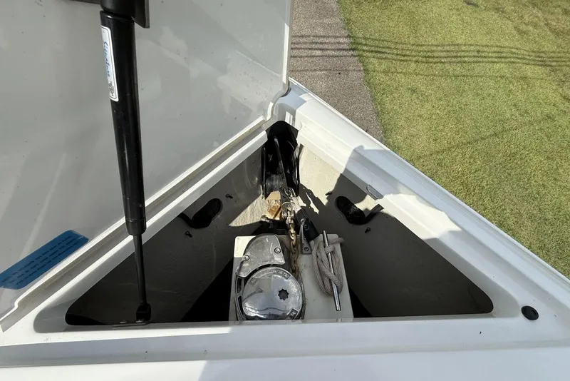 Slide: The Image of 2020 Cobalt R5 Surf boat anchor compartment with ropes and chains. - 13