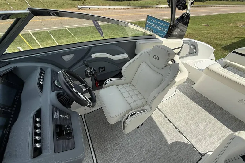 Slide: The Image of 2020 Cobalt R5 Surf boat interior with steering wheel and captain's chair. - 18