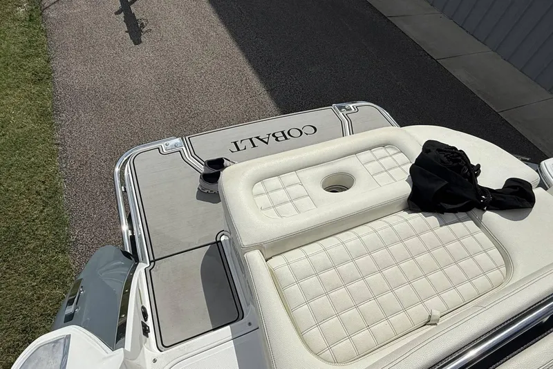 Slide: The Image of 2020 Cobalt R5 Surf boat with cushioned seating and deck view. - 27