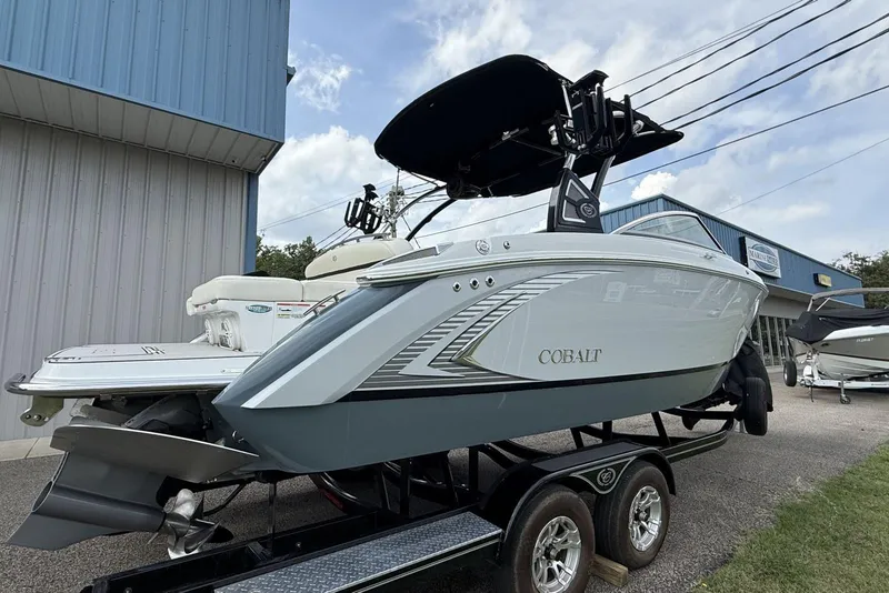 Slide: The Image of 2020 Cobalt R5 Surf boat on trailer outside a marine dealership. - 8