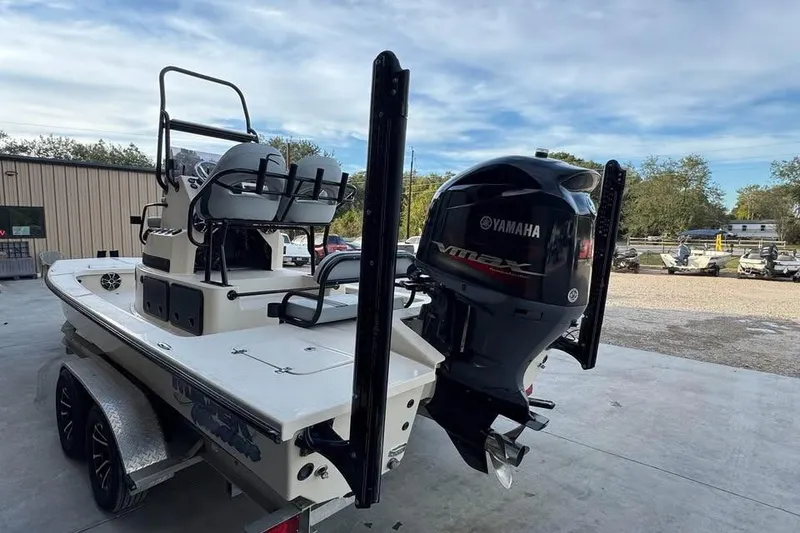 Slide: The Image of 2013 Majek 226 Illusion boat with Yamaha VMAX engine, parked outdoors. - 11