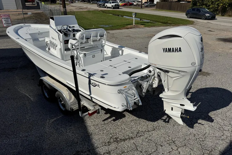 Slide: The Image of 2026 BlackJack 256 Bay boat with Yamaha outboard motor on a trailer. - 1