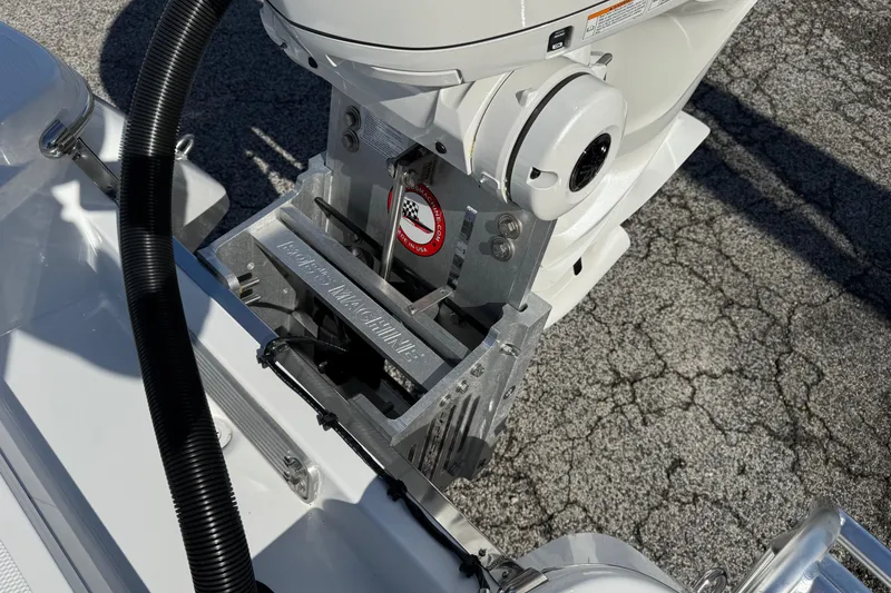 Slide: The Image of 2026 BlackJack 256 Bay boat engine mount detail on textured surface. - 22