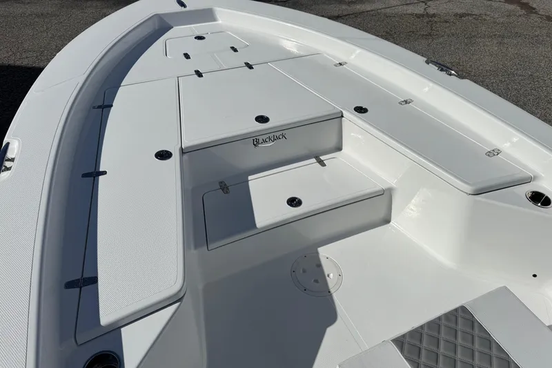 Slide: The Image of 2026 BlackJack 256 Bay boat deck with storage compartments and seating. - 9