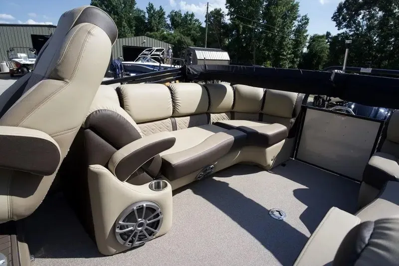 Slide: The Image of 2023 Veranda VP 22RC boat interior with luxurious beige seating and built-in speaker. - 12