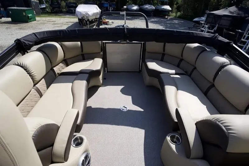 Slide: The Image of 2023 Veranda VP 22RC pontoon boat interior with luxurious beige seating and cup holders. - 13