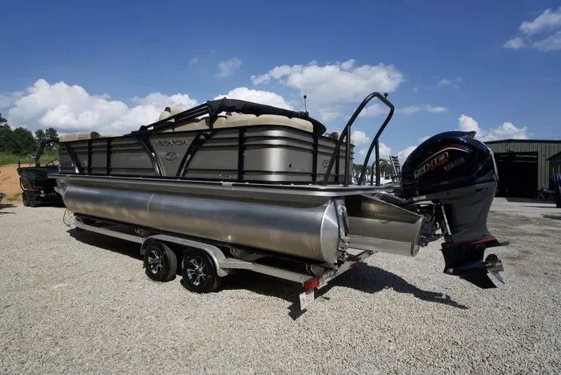 Slide: The Image of 2023 Veranda VP 22RC pontoon boat with Yamaha engine on a trailer, under blue sky. - 17