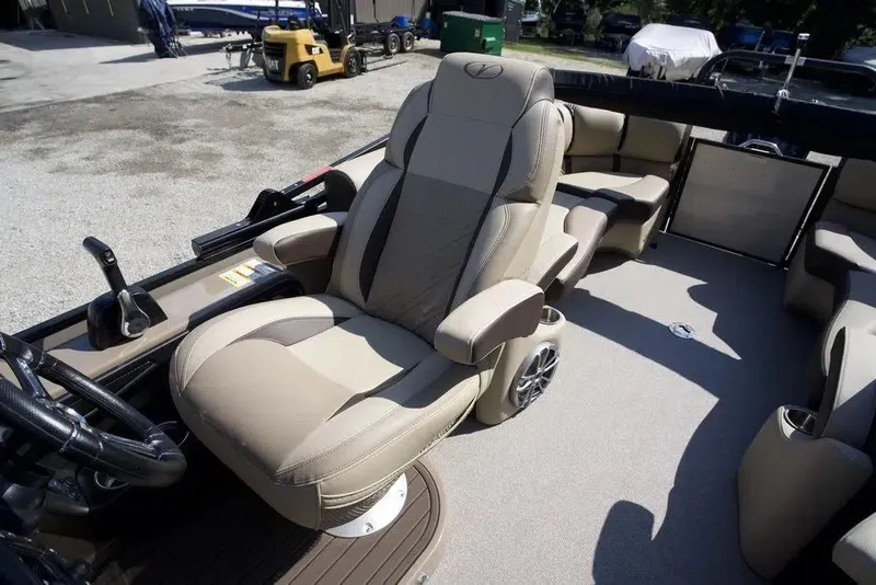 Slide: The Image of 2023 Veranda VP 22RC boat interior with luxurious captain's chair and modern controls. - 7