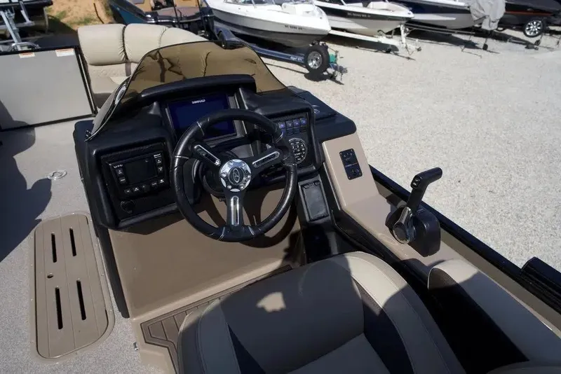 Slide: The Image of 2023 Veranda VP 22RC boat cockpit with steering wheel and controls. - 8