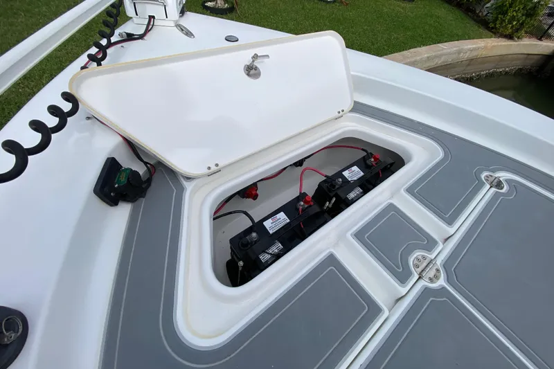 Slide: The Image of Open battery compartment on 2004 Palmetto 22 Excursion boat, showing wiring and connections. - 23