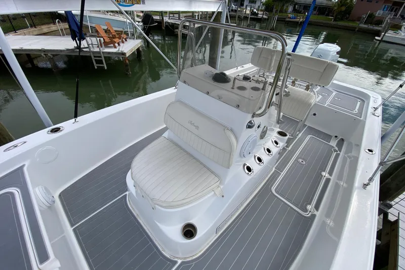 Slide: The Image of 2004 Palmetto 22 Excursion boat with sleek white seating and modern deck design. - 30