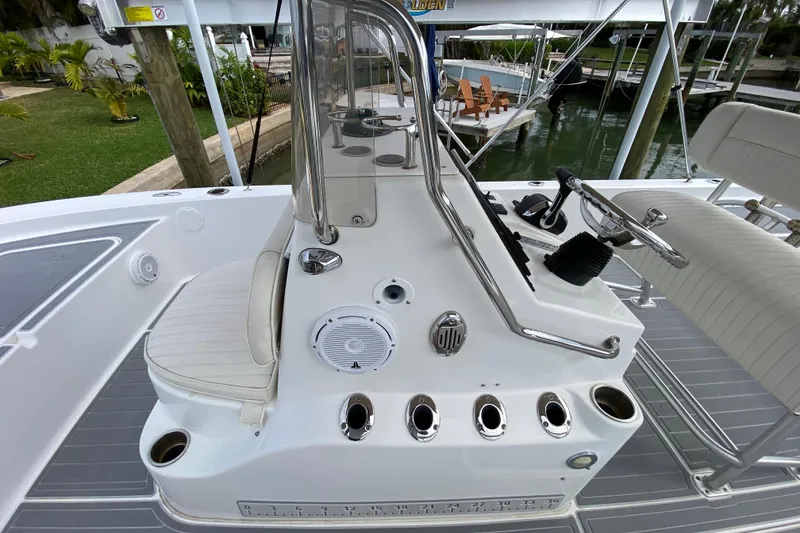 Slide: The Image of 2004 Palmetto 22 Excursion boat interior with steering console and seating. - 36