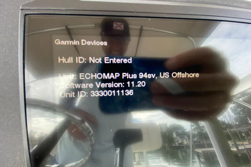 Slide: The Image of Reflection on Garmin device screen displaying ECHOMAP Plus 94sv information on a 2004 Palmetto 22 Excursion. - 42