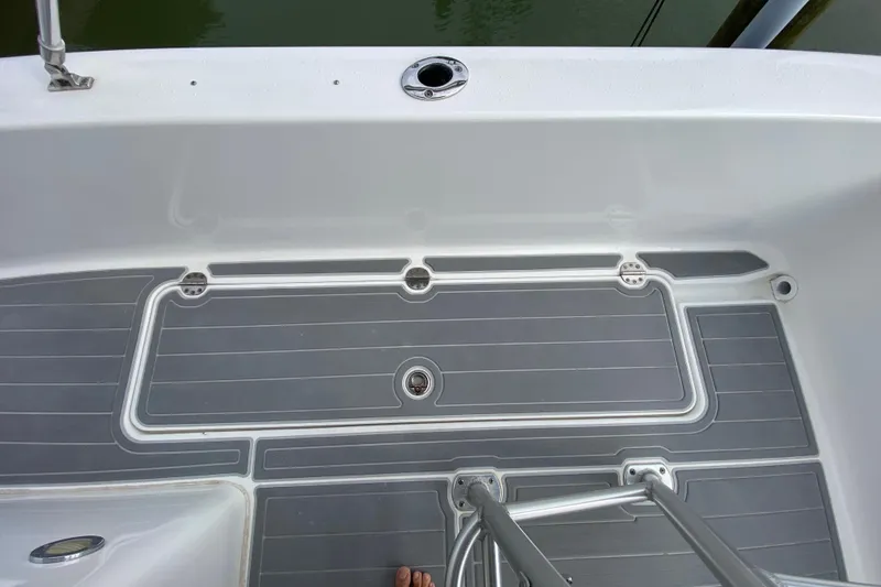 Slide: The Image of 2004 Palmetto 22 Excursion boat deck with gray non-slip surface and stainless steel fittings. - 51