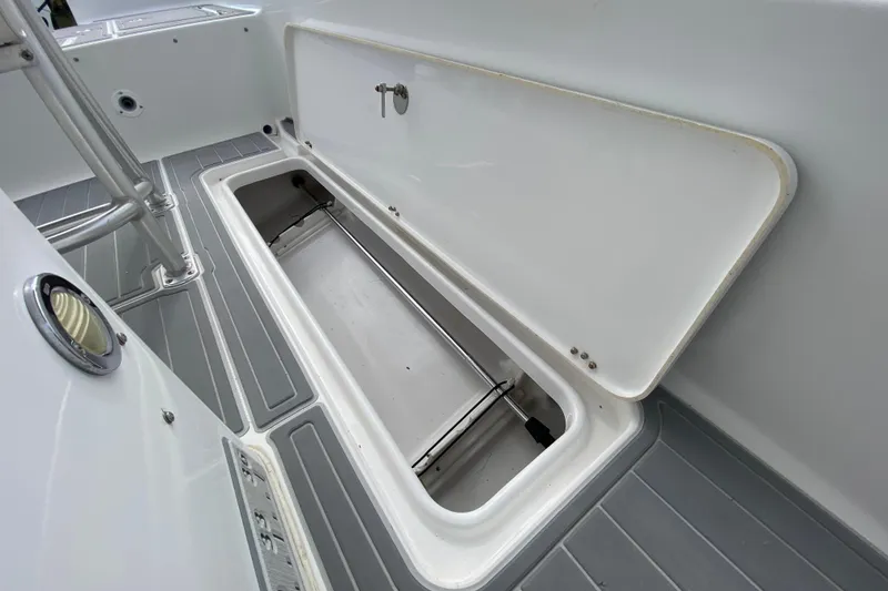 Slide: The Image of Open storage compartment on 2004 Palmetto 22 Excursion boat deck. - 54