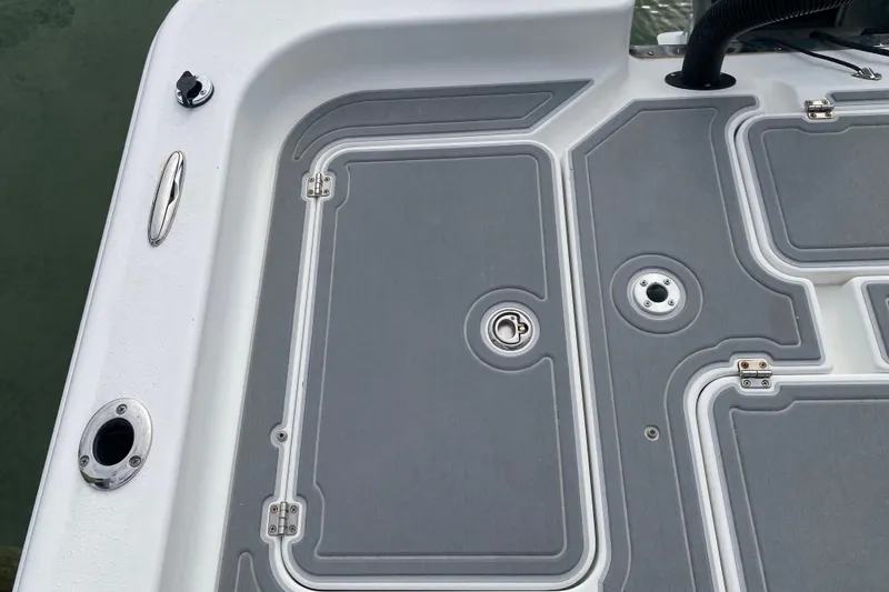 Slide: The Image of Deck of 2004 Palmetto 22 Excursion boat with storage compartments and fittings. - 62