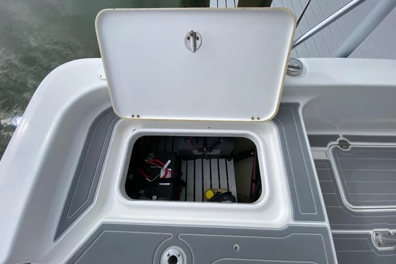 Slide: The Image of Open storage compartment on 2004 Palmetto 22 Excursion boat, showing interior equipment. - 69
