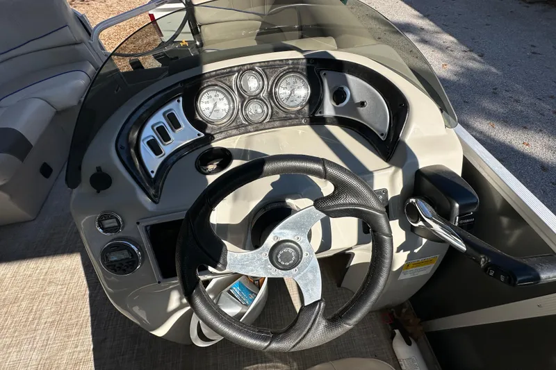 Slide: The Image of Steering console of 2017 SunCatcher V18 Cruise boat with gauges and controls. - 16
