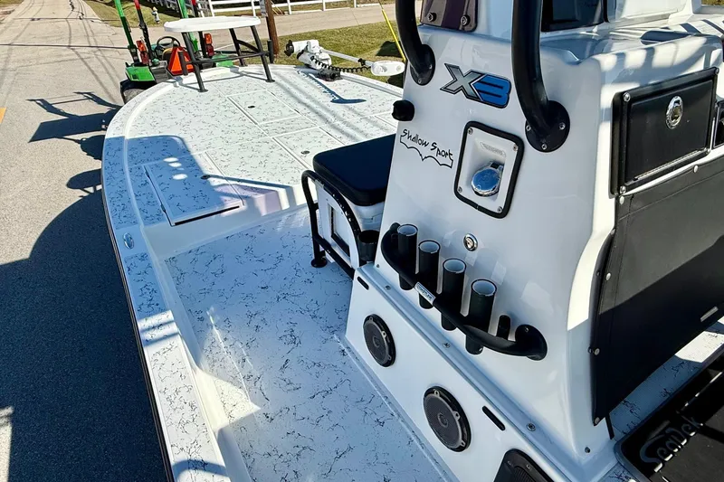 Slide: The Image of 2018 Shallow Sport 25 X3 boat with white deck and fishing rod holders. - 12
