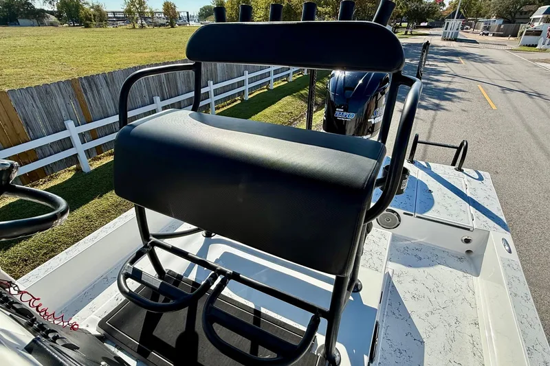 Slide: The Image of 2018 Shallow Sport 25 X3 boat with seating and Yamaha 250 engine, parked outdoors. - 9