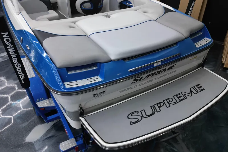 Slide: The Image of 2012 Supreme V226 boat, blue and gray, with "World Class Towboats" branding. - 12