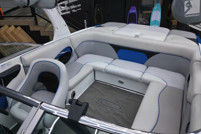 Slide: The Image of Interior of a 2012 Supreme V226 boat with gray and blue seating. - 7